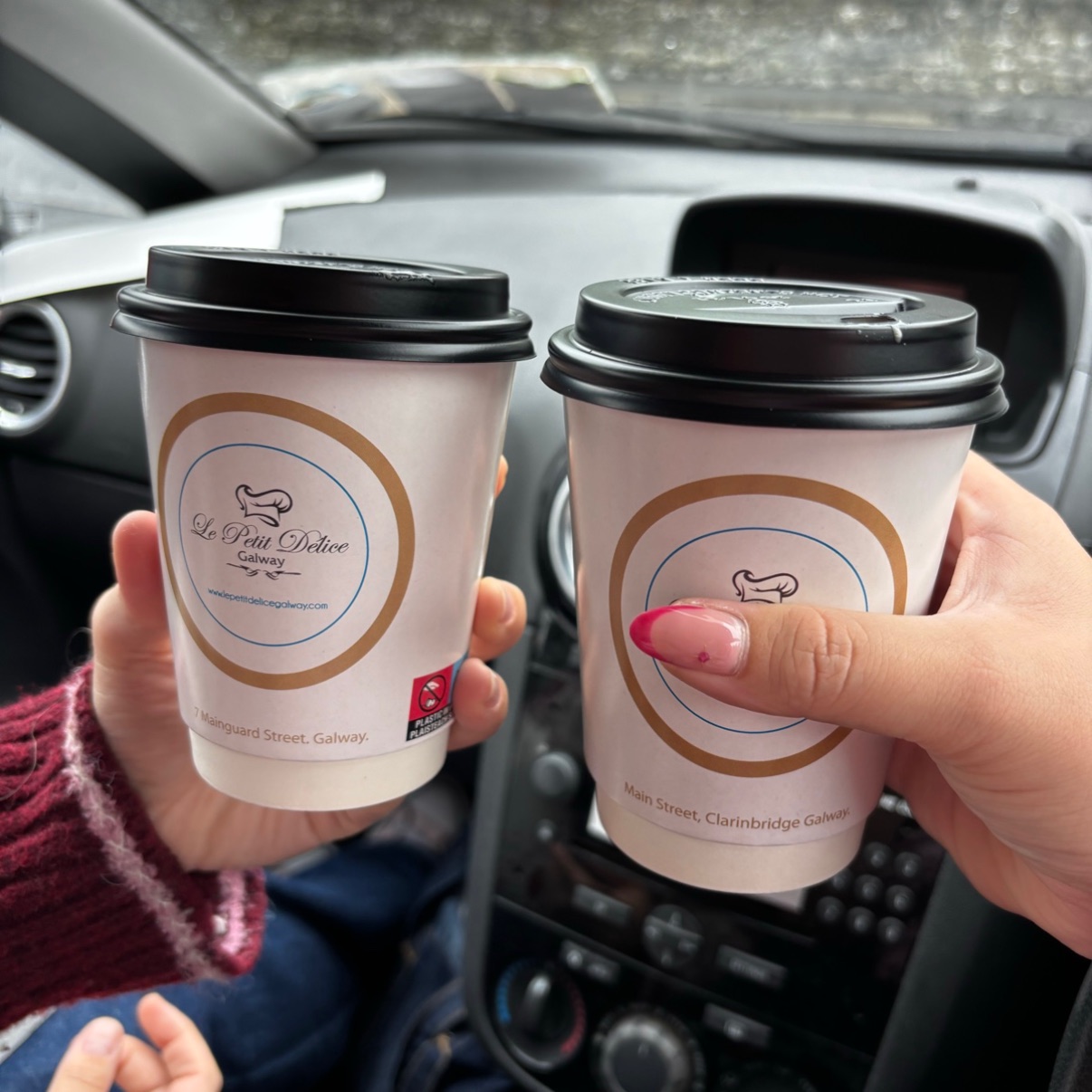 Two takeaway hazelnut flat whites